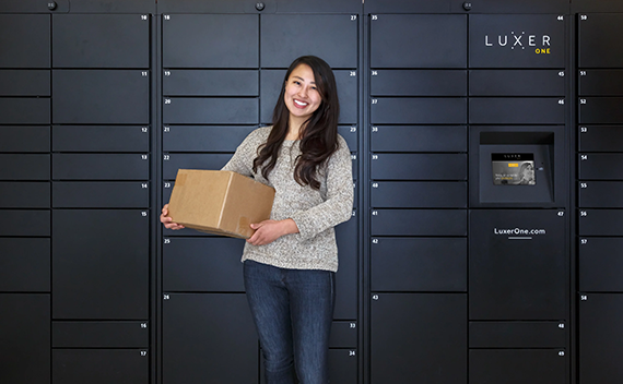 Student in front of Luxer One Lockers